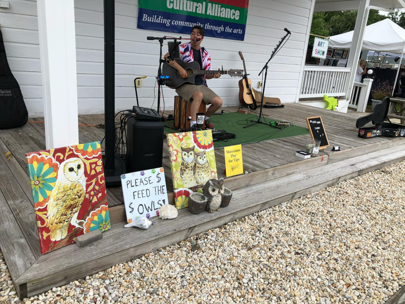 solo artist playing at the farmers market